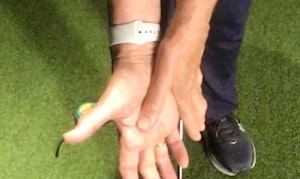 Correct position for bottom hand for a side under golfer